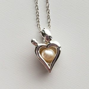 Vantel Pearl's mother and child cage necklace.